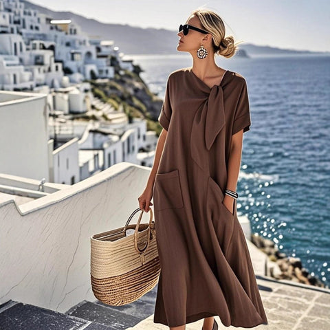 Summer new temperament short-sleeved bow pocket big pendulum loose long dress m302437